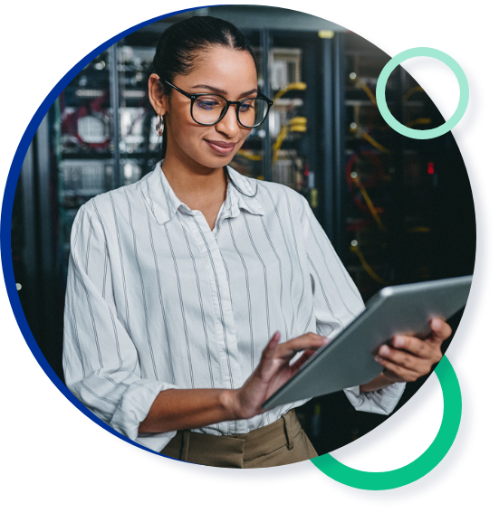 Woman using a tablet in a server room